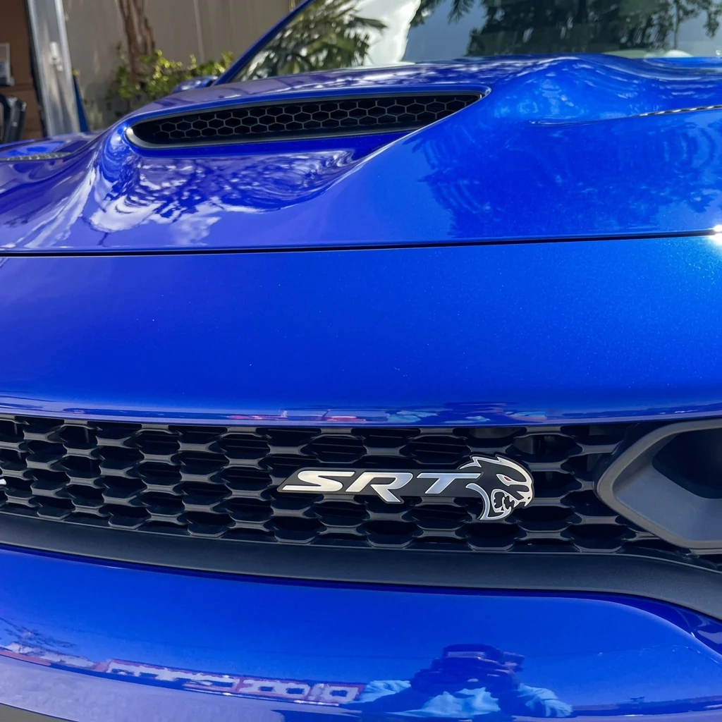 Dodge Charger SRT Badge after professional mobile detailing by Clean Image Mobile Detailing in Sparks, NV